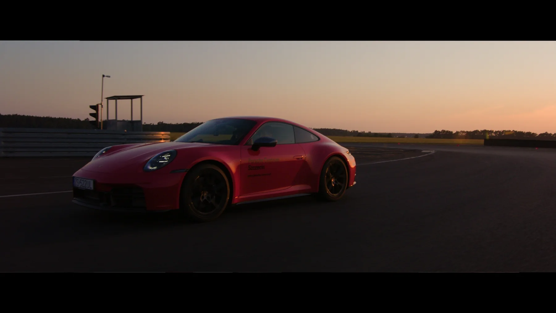 A red car on the road — frame from the TCOS series